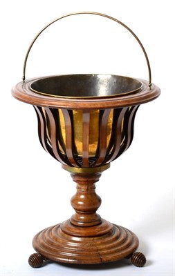 Lot 1473 - A 19th Century Walnut Peat Bucket, with brass swing handle and liner, the pierced body raised...