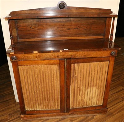 Lot 1481 - A Regency Rosewood Chiffonier, early 19th century, with architectural pediment above a...