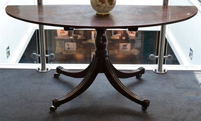 Lot 1487 - A George III Mahogany D-End Table, early 19th century, with a flip top and reeded edge, raised on a