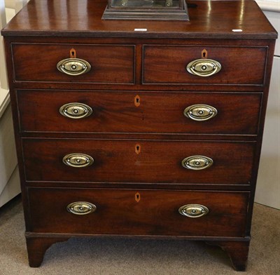 Lot 1493 - A George III Mahogany Straight Front Chest of Drawers, circa 1800, with reeded edge above two short