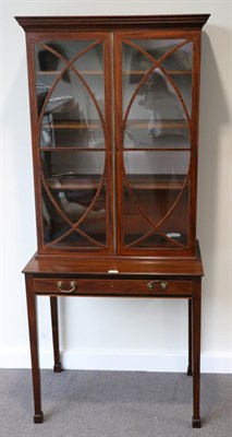 Lot 1495 - A Late George III Mahogany Bookcase Writing Table, early 19th century, the upper section with...