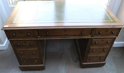 Lot 1496 - A Victorian Mahogany Double Pedestal Desk, late 19th century, with green and gilt leather...