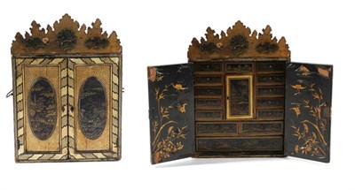 Lot 1512 - A Chinese Export Japanned and Gilt Decorated Table Cabinet, richly painted with buildings and...