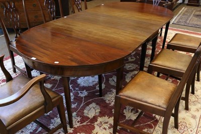 Lot 1522 - A George III Mahogany D End Dining Table, early 19th century, in three sections, the middle section