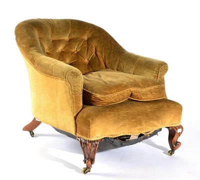 Lot 1544 - A Victorian Walnut Framed Tub Shape Armchair, circa 1870, covered in yellow buttoned velvet...