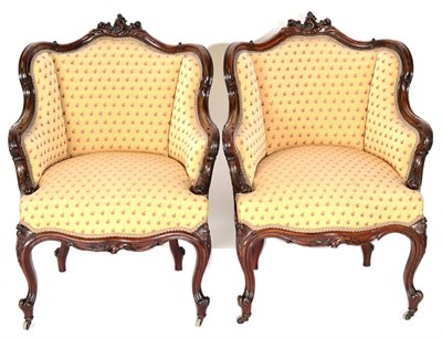 Lot 1552 - A Pair of Victorian Carved Mahogany Armchairs, in Louis XV style, recovered in yellow and fruit...