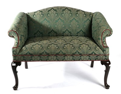 Lot 1558 - A George III Style Camel Back Bedroom Sofa, upholstered in green floral fabric with rounded arm...