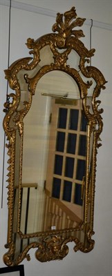 Lot 1565 - A Régence Style Gilt and Gesso Marginal Mirror, mid 19th century, the flowerhead frame with...