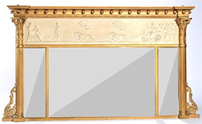 Lot 1567 - A Regency Gilt and Gesso Triptych Overmantel Mirror, early 19th century, of breakfront form...