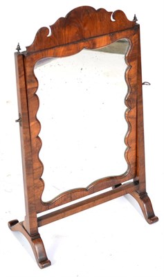 Lot 1578 - A Walnut Dressing Table Mirror, the mercury plate contained within a moulded frame with shaped...