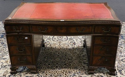 Lot 1587 - A Mahogany Chippendale Style Serpentine Shaped Double Pedestal Desk, 20th century, with inset...