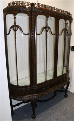 Lot 1588 - A Chippendale Revival Carved Mahogany Breakfront Display Cabinet, labelled Chippendale House, Wells