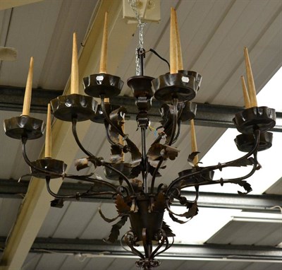 Lot 408A - An Impressive Brown Patinated Twelve-Branch Chandelier, early 20th century, with scrolled arm...