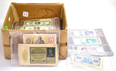 Lot 234 - A Large Collection of Approximately 470 x Foreign Banknotes, of which 380 in album leaves,...