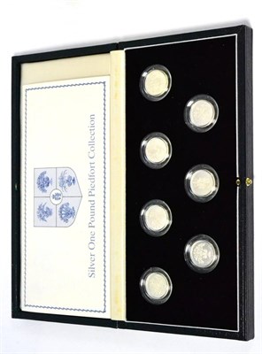 Lot 99 - A Silver Proof Set of 7 x Piedfort £1 Coins comprising: 1983 'Royal Arms,'  Machin portrait,...