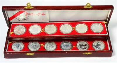 Lot 255 - China, a Set of 12 x Silver Medalets depicting the 12 animals of the Chinese zodiac for the...