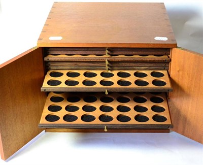 Lot 406 - A Mahogany Coin Cabinet, 32.5cm x 30cm x 26.5cm, containing 20 trays with double-holed spaces...