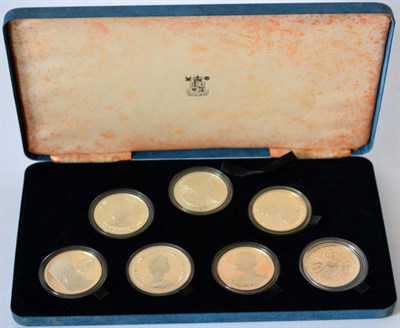 Lot 113 - A Set of 7 x Silver Crowns 1980 'Queen Mother's 80th Birthday' issued by UK, Guernsey, Tristan...