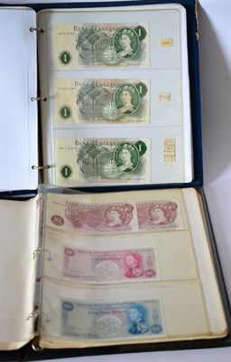 Lot 343 - A Collection of Bank of England Notes in Two Albums comprising: ALBUM 1: 2 x £20: Fforde A01...