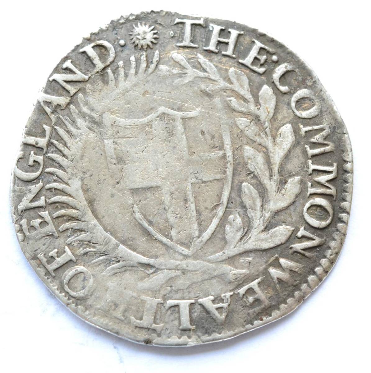 Lot 34 - Commonwealth Shilling 1651 MM sun; obv. struck slightly off-centre, a few contact marks, AFine