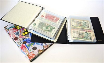 Lot 276 - A Large Collection of Approximately 300 x Foreign Banknotes in Three Albums comprising: (1)...