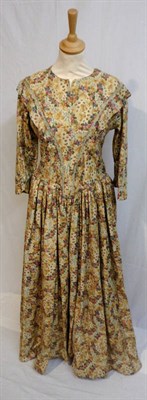 Lot 26 - A Circa 1860 Wool Floral Printed Long Sleeved Dress, with a dropped shoulder and pagoda...