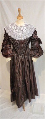 Lot 27 - A Circa 1860 Brown Striped Silk Taffeta Dress, with a pleated v shaped bodice trimmed with...