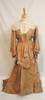 Lot 29 - A Circa 1870's Brown Printed Silk Taffeta Dress, with pagoda sleeves, brass buttons to the...