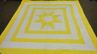 Lot 34 - An Elizabeth Sanderson Quilt with a Central Eight-Pointed Yellow Star, within white and yellow...