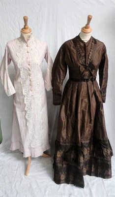 Lot 44 - A Victorian Brown Silk Dress, with long sleeves, brown brocade ribbon trims to the bodice,...