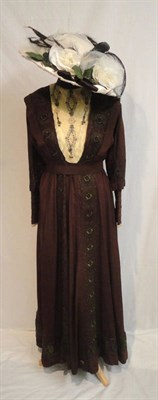 Lot 52 - A Circa 1900 Edwardian Brown Silk Day Dress with a cream lace insert appliqued with rose...