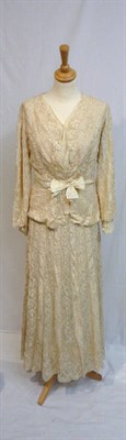Lot 54 - An Edwardian Cream Lace Two Piece, comprising a long skirt with scalloped edge and fitted long...