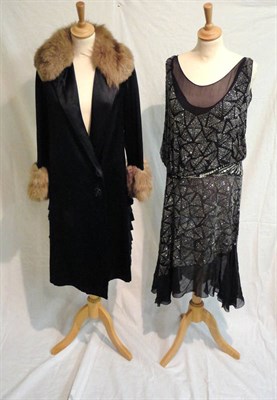 Lot 64 - A Circa 1920's Black Chiffon and Beaded Shift Dress, with triangular shaped bead designs and a...