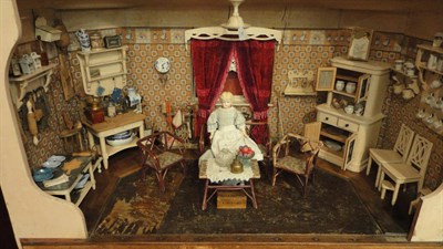 Lot 81 - A Circa 1930's Dolls Kitchen Room Setting, with papered walls and a matching border of young...