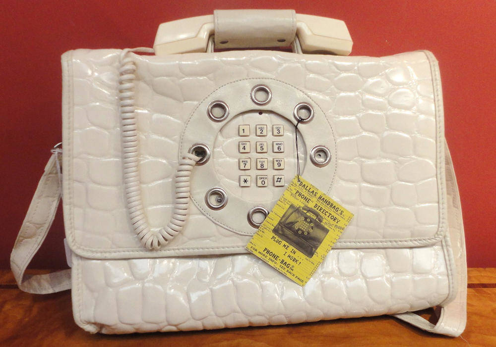 Lot 116 - A Dallas Handbag's Circa 1970's Phone Directory Bag, in white vinyl combining a fully...