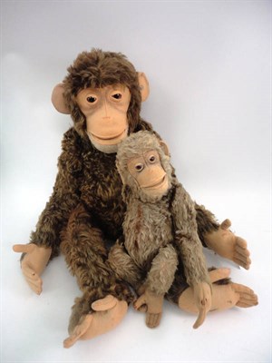 Lot 1009 - A Large Steiff Jointed Monkey with dark brown plush, with metal button to ear, felt face and...