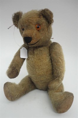 Lot 1011 - Circa 1930's Yellow Plush Jointed Teddy Bear with stitched nose and cotton paw pads, 42 cm