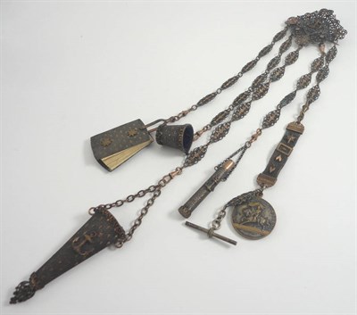 Lot 1052 - Pierced and Gilt Metal Chatelaine with five attachments, each bearing the motif of an applied...