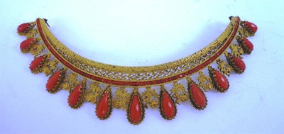Lot 1062 - A Coral Diadem, late 19th Century, of graduated fringe form, set with faceted pear shaped coral...