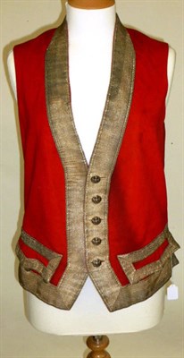 Lot 1129 - 19th Century Red Wool Livery Waistcoat with a woven white metal applique trim, cotton lining,...