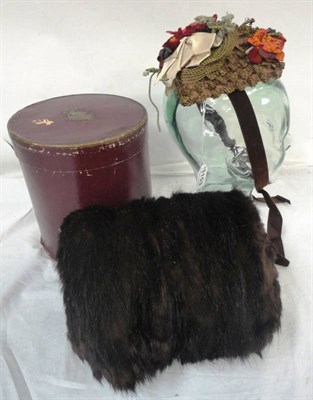 Lot 1153 - An Edwardian Small Straw Work Bonnet with velvet and fabric adornments and a Fur Muff in...