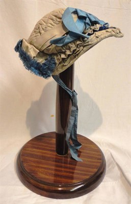 Lot 1154 - Victorian Grey Silk Quilted Bonnet, with blue silk ribbons and trims
