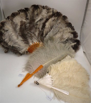 Lot 1156 - Cream Ostrich Feather Fan With Mother of Pearl Sticks and Guards, 40 cm and two others (3)