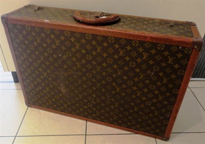 Lot 1169 - A Louis Vuitton Monogrammed Suitcase, with brass mounts, leather handle and trims, bearing a...