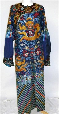 Lot 1177 - Late 19th Century Chinese Blue Silk Dragon Robe, embroidered with five clawed dragons in gold...