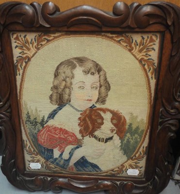 Lot 1180 - 19th Century Wool Work Picture of a Young Girl Seated With a Spaniel, within a carved mahogany...