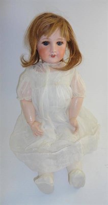 Lot 1002 - Unis French Bisque Socket Head Doll '301', with sleeping blue eyes, brown wig, open mouth, on a...