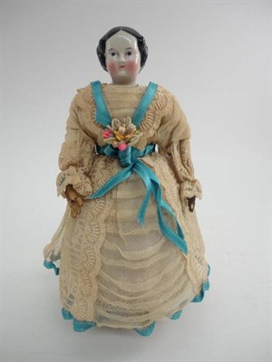 Lot 1004 - China Head Walking Doll Automaton, with painted black hair and face, wearing a lace dress with blue