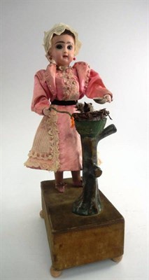 Lot 1005 - French Bisque Socket Head Doll Automaton, comprising a standing doll with fixed blue eyes,...