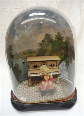 Lot 1006 - Late 19th Century French Bisque Doll Automaton of a young girl playing the piano, on an oval...